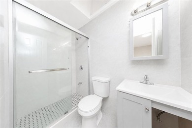 Welcome to 2401 64th Street, a rare 3-family corner brick - photo 7