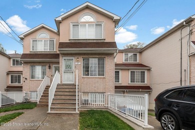 Welcome home to this exceptional two-family residence nestled in - photo 1