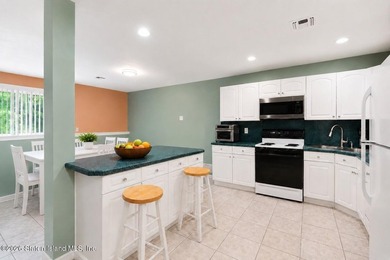 Welcome home to this exceptional two-family residence nestled in - photo 9