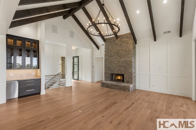 Nestled within the gates of Wildcat Cliffs Country Club but part