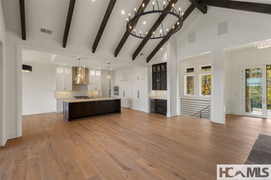 Nestled within the gates of Wildcat Cliffs Country Club but part