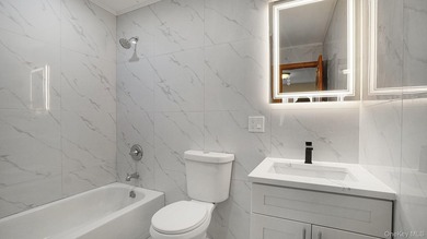 Newly Renovated Brick Two-Family House located within a block - photo 10