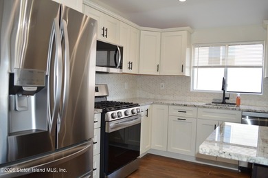 Welcome to this well maintained, fully detached 2-family home in - photo 7