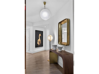 Positioned as a refined corner residence, this professionally