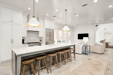 Ample entertaining space and coastal casual elegance combine in - photo 10