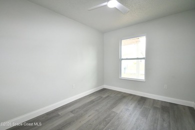 This updated Palm Bay home is set just off a main road, making - photo 11