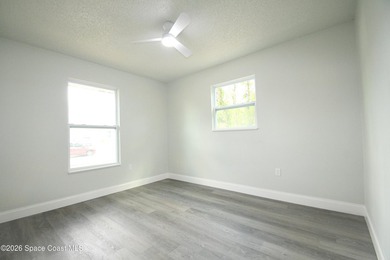 This updated Palm Bay home is set just off a main road, making - photo 12