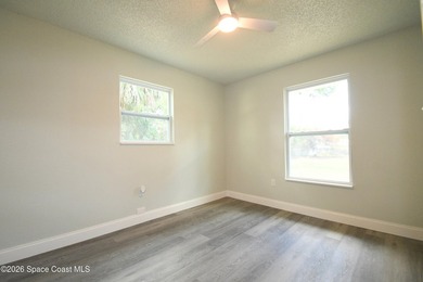 This updated Palm Bay home is set just off a main road, making - photo 13