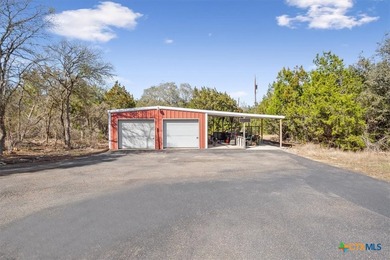 Tucked away on 15 serene, wooded acres through two private - photo 36