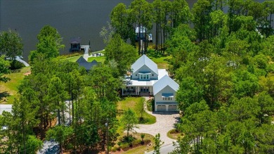 This coastal custom home is set on a protected bayou with serene - photo 1