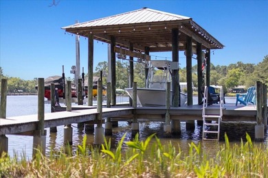 This coastal custom home is set on a protected bayou with serene - photo 3