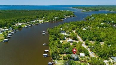This coastal custom home is set on a protected bayou with serene - photo 4