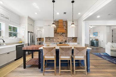 This coastal custom home is set on a protected bayou with serene - photo 5