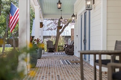 This coastal custom home is set on a protected bayou with serene - photo 6