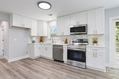 Welcome home to this beautifully updated 4-bedroom, 2-bath - photo 11