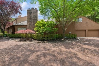 Tucked away on 1.4 acres of lush, landscaped grounds, this - photo 2