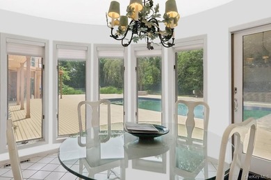 Tucked away on 1.4 acres of lush, landscaped grounds, this - photo 8
