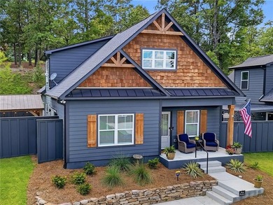 Sophistication meets the relaxed charm of lake living. This - photo 3