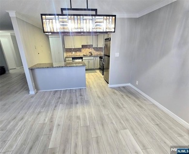 Beautifully Renovated Condo in the Prestigious World Plaza is