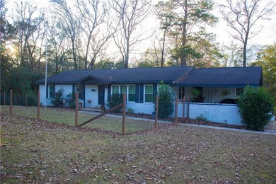 PRICE REDUCED! Welcome to this inviting 3-bedroom, 2-bath brick