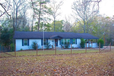 PRICE REDUCED! Welcome to this inviting 3-bedroom, 2-bath brick