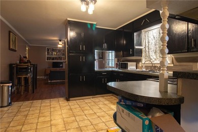 PRICE REDUCED! Welcome to this inviting 3-bedroom, 2-bath brick