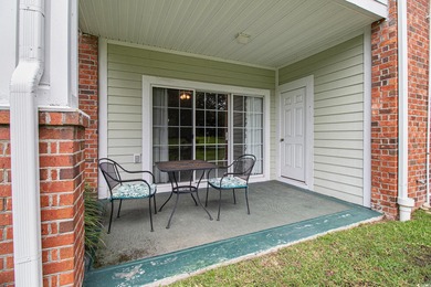 Enjoy effortless coastal living in this first floor, end-unit