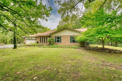 Well-maintained brick home situated on 3 acres outside the city - photo 2