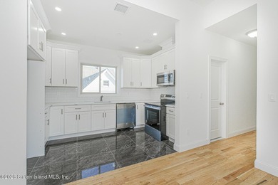 Brand-new 6 over 6 two-family home located in the desirable - photo 7