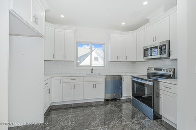 Brand-new 6 over 6 two-family home located in the desirable - photo 8