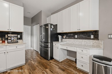 Located in the heart of Bayside Lakes, this beautifully - photo 14