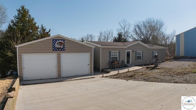 This charming 1,350 sq ft manufactured home sits on a permanent - photo 1