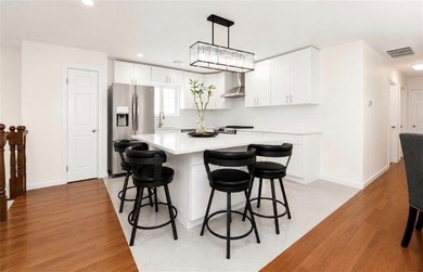 Beautifully renovated two-family home in the heart of - photo 9
