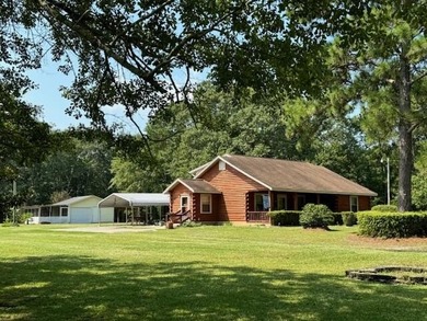 Discover tranquility & charm in this immaculate log cabin - photo 1