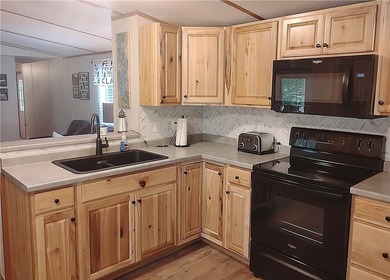 Rare offering! Affordable fully furnished lakefront retreat with - photo 4
