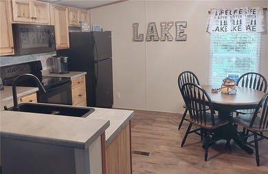 Rare offering! Affordable fully furnished lakefront retreat with - photo 5