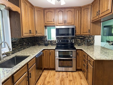 Enjoy lakeside living in this furnished, ranch-style home with - photo 34