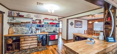 LAKEFRONT RUSTIC CHARM + PLATFORM DOCK!! Nestled along the