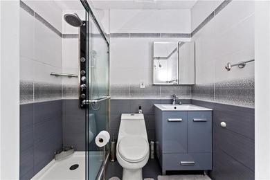 Beautifully renovated modern design, this legal 2-family brick - photo 8
