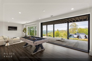 Set within the gated community of Pilots Knob, this thoughtfully - photo 5