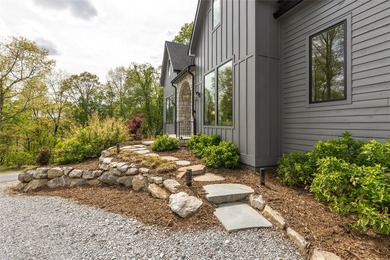 Set within the gated community of Pilots Knob, this thoughtfully - photo 8
