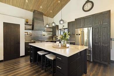 Modern mountain living meets golf course serenity in this - photo 11