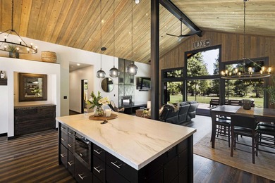 Modern mountain living meets golf course serenity in this - photo 16