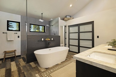 Modern mountain living meets golf course serenity in this - photo 21