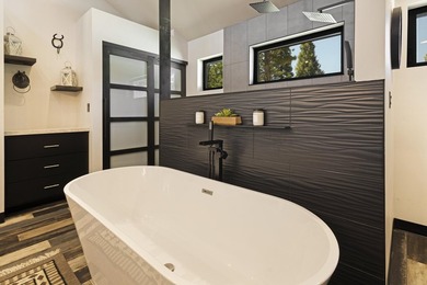 Modern mountain living meets golf course serenity in this - photo 22