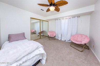 This stunning brick-trimmed Palmdale home is nestled in the - photo 8