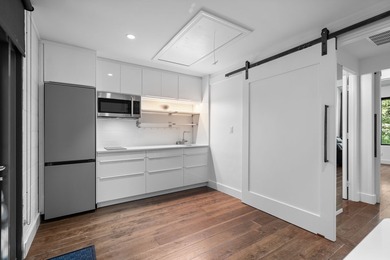 Nestled beneath a canopy of mature trees with sweeping views of - photo 26