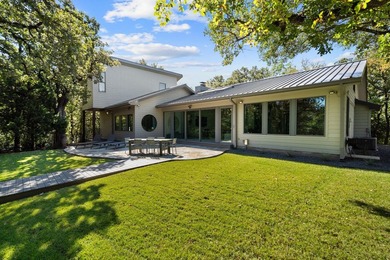 Nestled beneath a canopy of mature trees with sweeping views of - photo 36