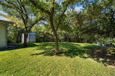 Nestled beneath a canopy of mature trees with sweeping views of - photo 37