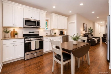Strong and sturdy detached brick 2-family home in the heart of - photo 2